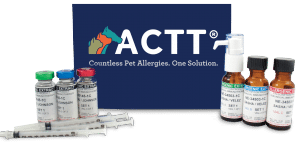 Image of a product set from ACTT, featuring bottles of pet allergy serums, a spray bottle, syringes, and a box with the text "ACTT Countless Pet Allergies. One Solution." Ideal for any veterinarian, the serums have colored caps for differentiation.